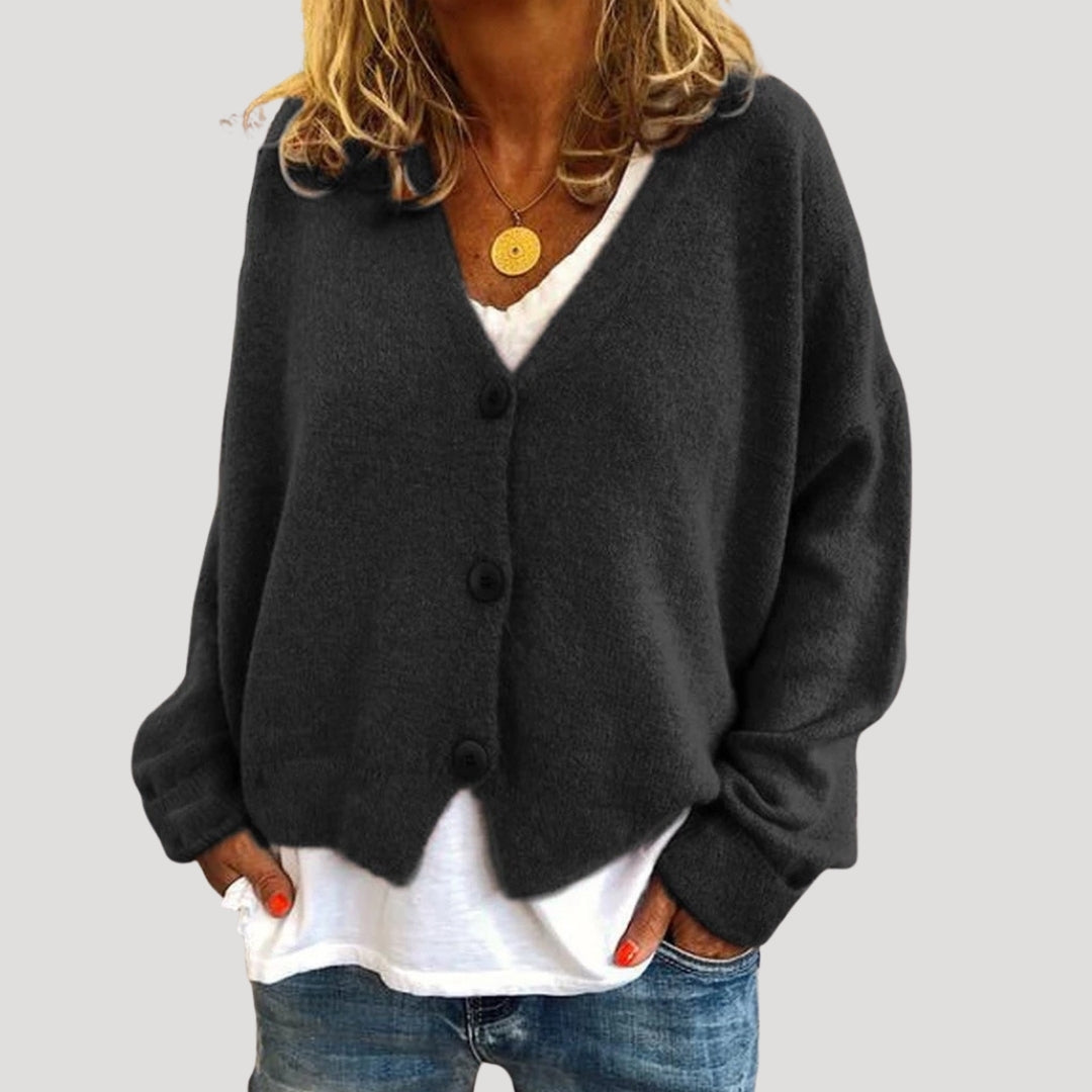 Women’s chunky cable knit cardigan with button up front for layering