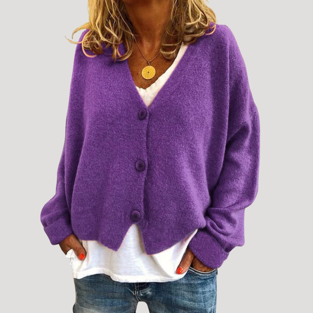 Women’s chunky cable knit cardigan with button up front for layering