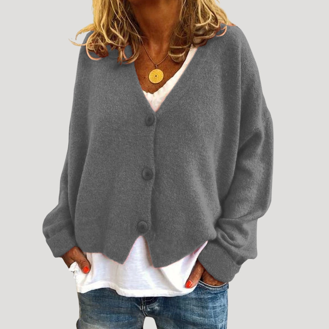 Women’s chunky cable knit cardigan with button up front for layering