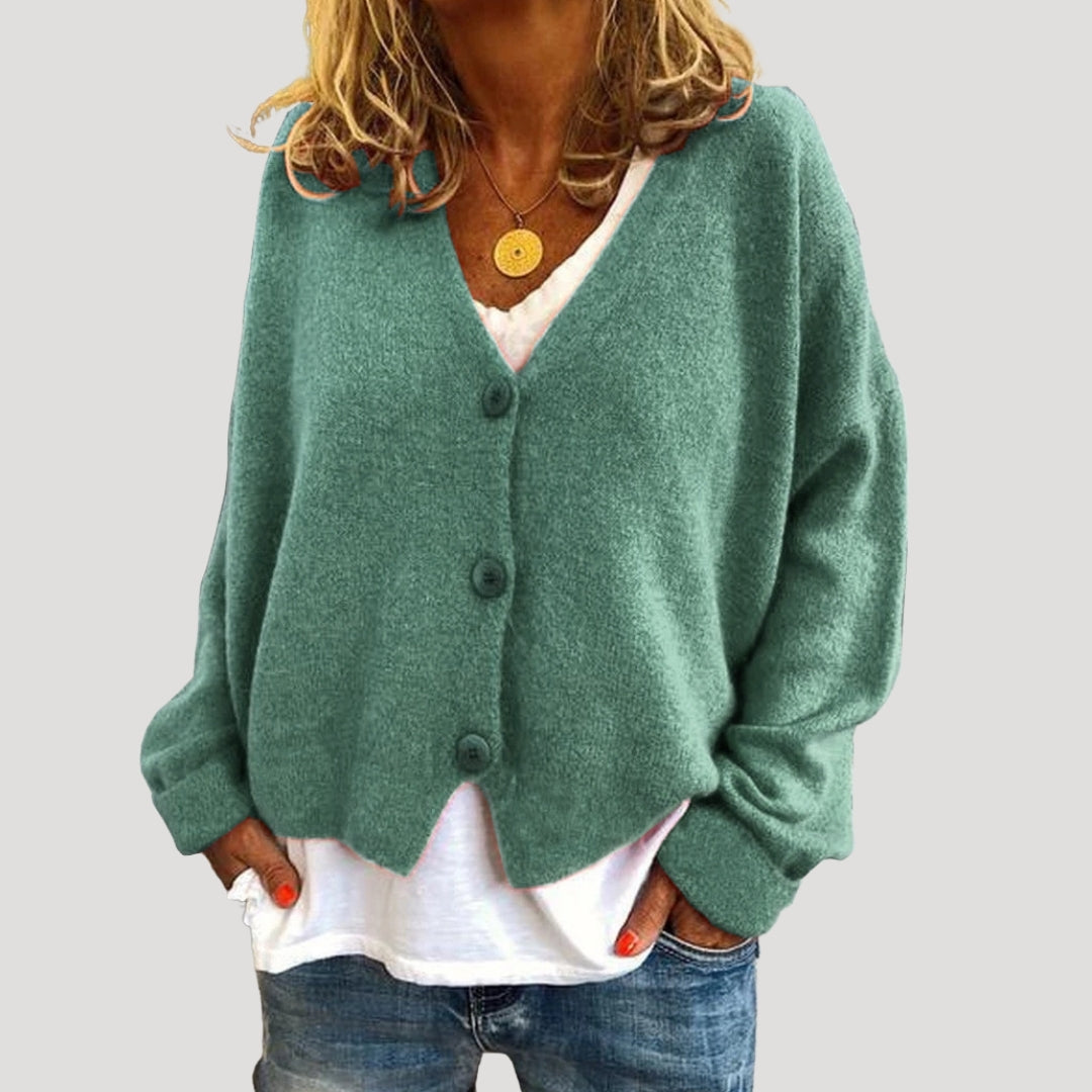Women’s chunky cable knit cardigan with button up front for layering