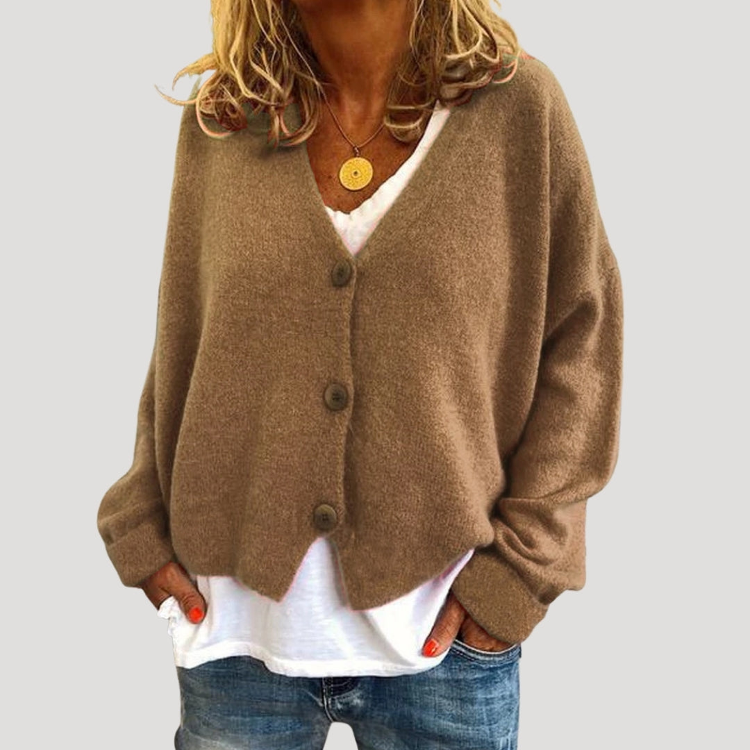 Women’s chunky cable knit cardigan with button up front for layering