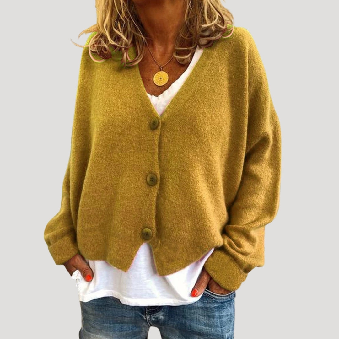 Women’s chunky cable knit cardigan with button up front for layering