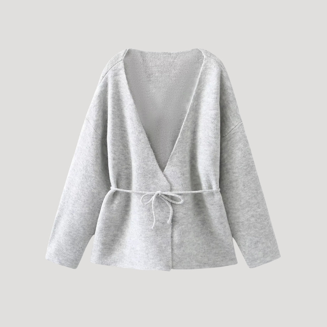 Women’s knit belted cardigan with peplum hem and V neck wrap style